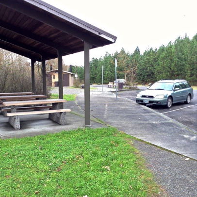 View of covered shelter, accessible restroom and parking spaces